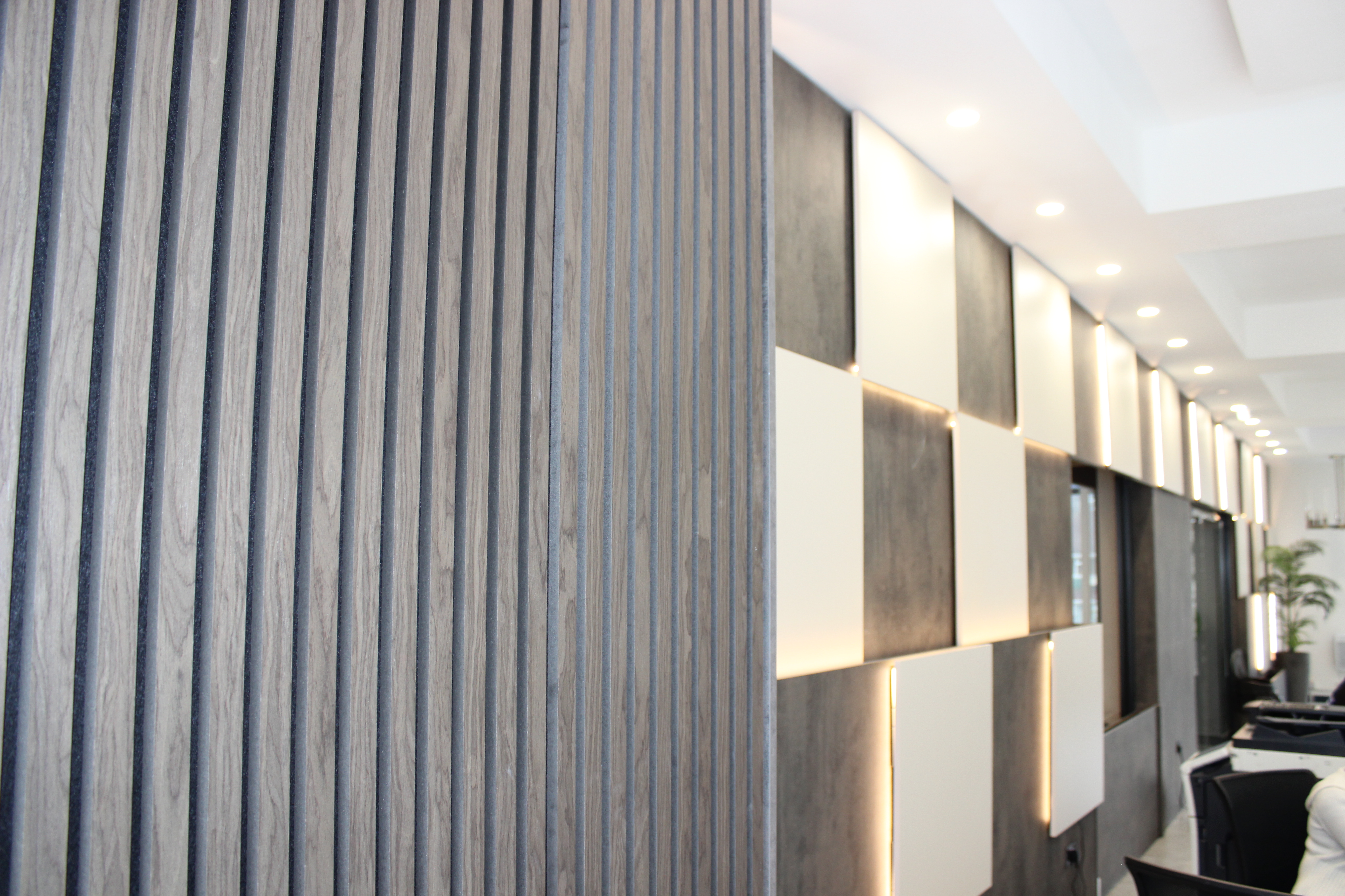 Modern wall with wooden slats and illuminated panels