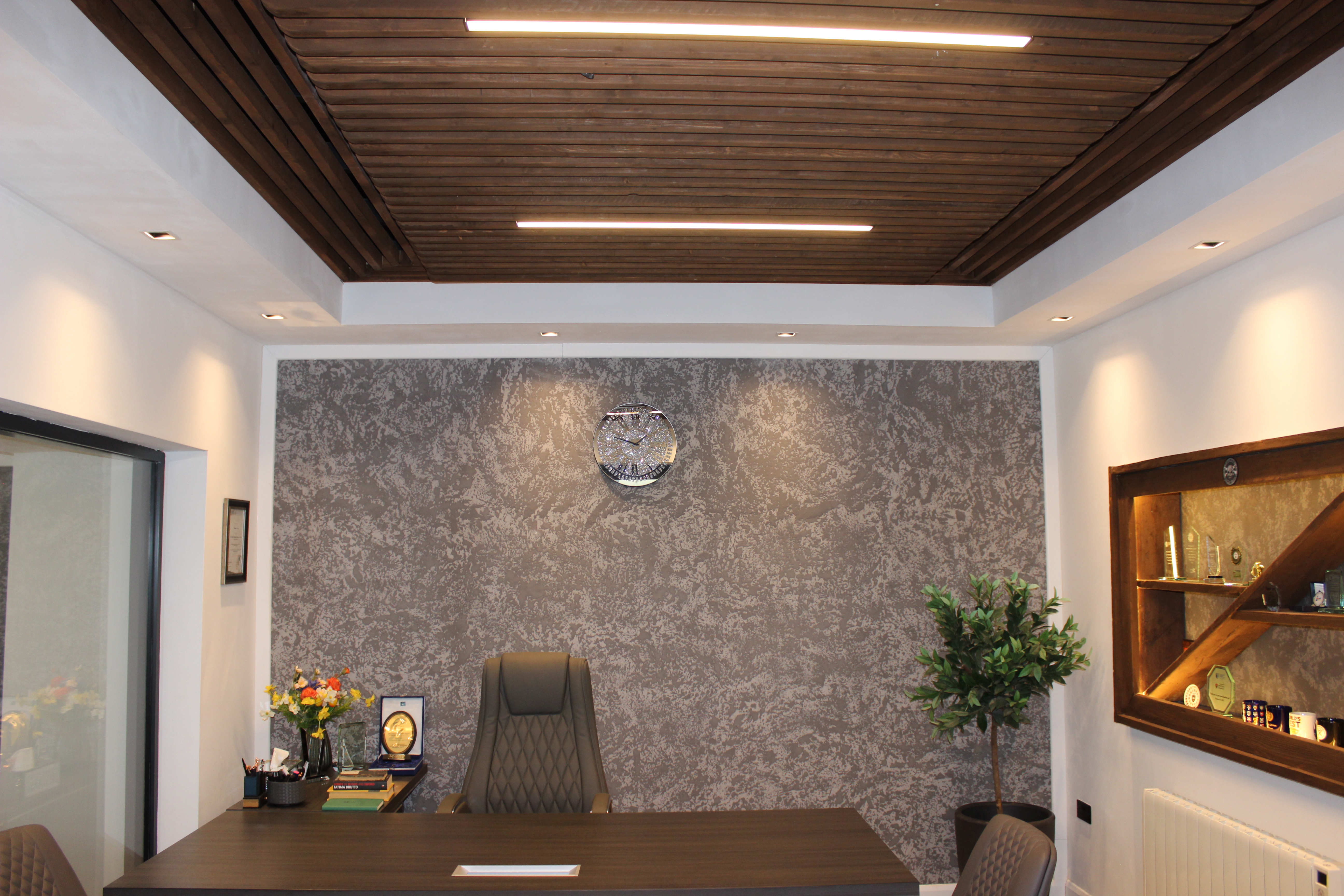 Executive office with textured accent wall